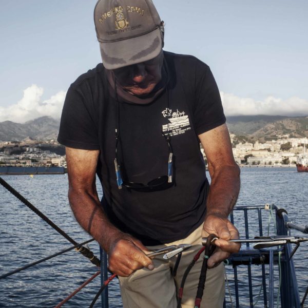 Fishing the swordfish to Stretto of Messina (Sicily) with Arena family on Simone boat.Story about passing the fishing tradition by father to son.Fight between human and animal, men against fish.